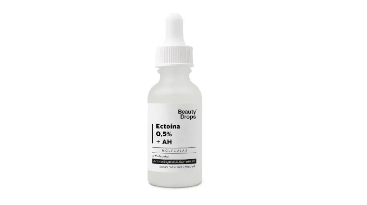 Frasco de sérum Beauty Drops con Ectoína 0,5% + AH, un suero hidratante antiedad.